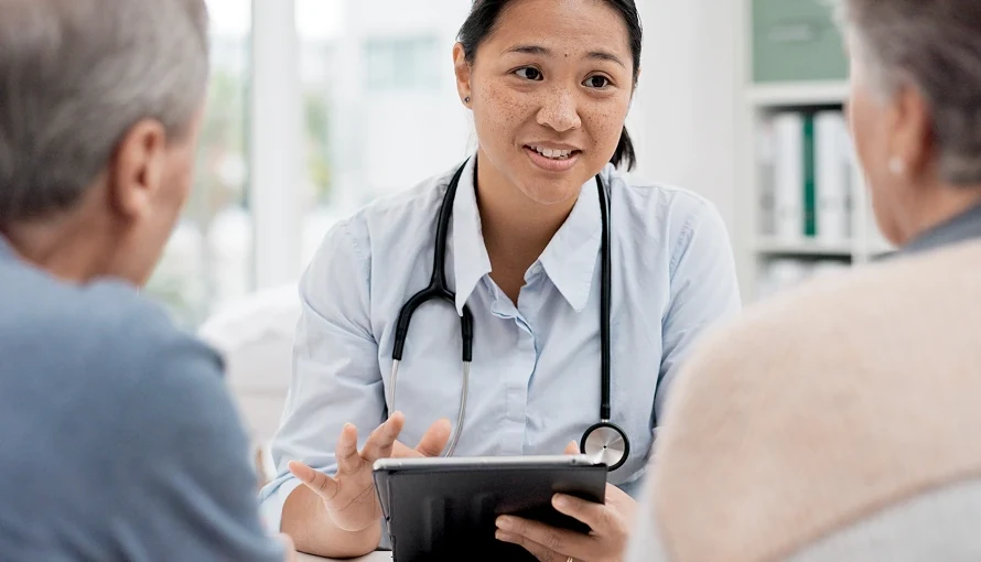 Veterinarian discussing with pet owners